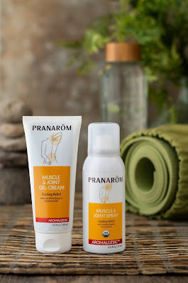 Pranarom Certified Organic Aromalgesic Muscle & Joint Gel-Cream and Spray bottles with green background.