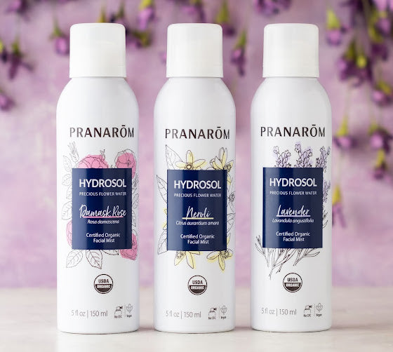 Pranarom Certified Organic Hydrosol Damask Rose, Neroli, Lavender Facial Mist bottles and plant background.